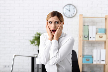 Woman having panic attack at workplace