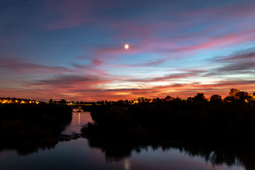 Sunset on the Guadalquivir river, taken from the Roman Bridge in Cordoba, Andalucia, Spain