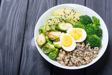 Buddha bowl with quinoa , eggs , avocado , brussels sprouts and broccoli