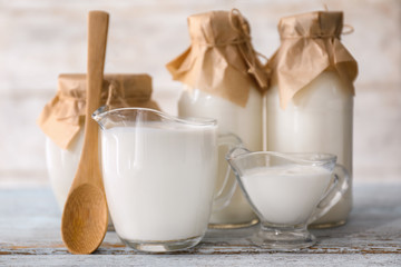 Different milk products on wooden table