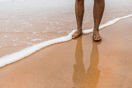Walking at the edge of the beach