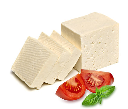 Feta cheese and tomatoes with basil leaf isolated on white background