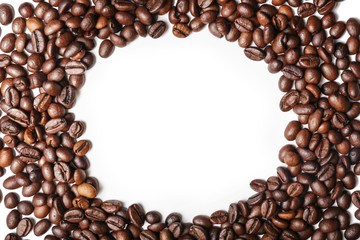Frame made of roasted coffee beans on white background
