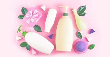 Banner Cosmetic packaging plastic bottle shampoo cream shower gel milk green leaves sponge box gift bow Natural organic product skin and hair care shopping Top view pink flat lay background.