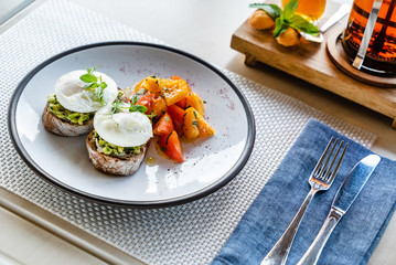 sandwich with avocado and poached eggs