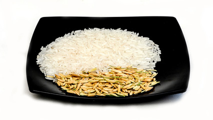 white rice (Thai Jasmine rice) in wooden bowl and unmilled rice isolated on white background