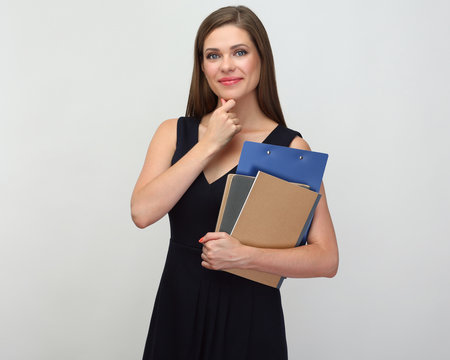 Woman teacher holding book and notebook