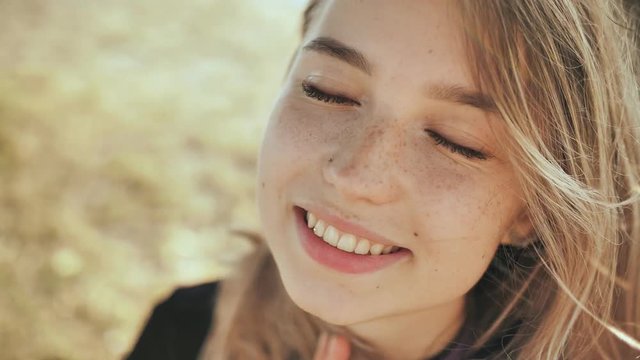 Face close-up of a nice young blonde russian girl.