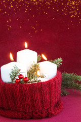 Christmas and New Year advent candles with a burning flame concept