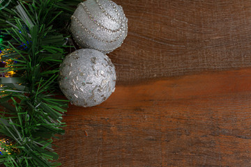 Christmas frame decoration. Silver metallic christmas ornaments . Wooden Background.  Copy Space