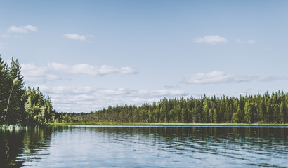 View across a lake in the woods in Swedish Lapland