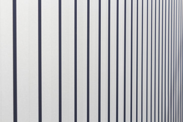 background of white and gray stripes on a metal base