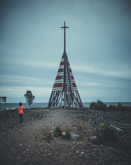 Wooden cross on Swedish island on a cloudy day