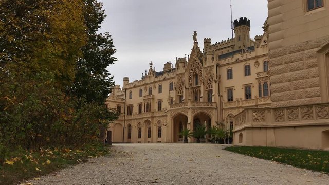 Facade appearance of Lednice castle, South Moravia, Czech Republic. Czechia tourist attraction. UNESCO Moravian Gothic revival palace in Lednice-Valtice Cultural Landscape. Two shots of Lednice castle