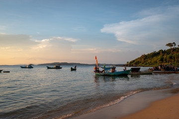 Boat on the beach at sunset