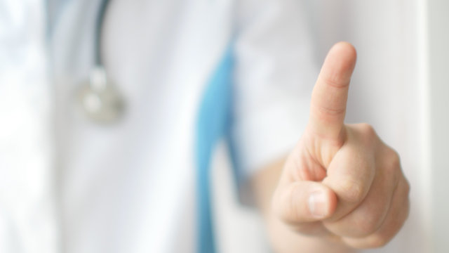 Medical Doctor Using One Finger For Pressing Virtual Touchscreen