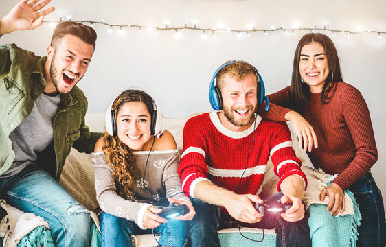 Group of millennials friends playing video games