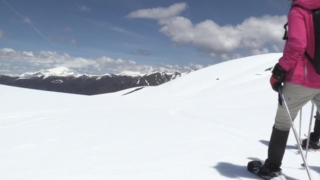 People walking in a mountain with snow