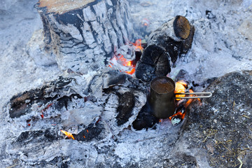 Cooking coffee on the fire.