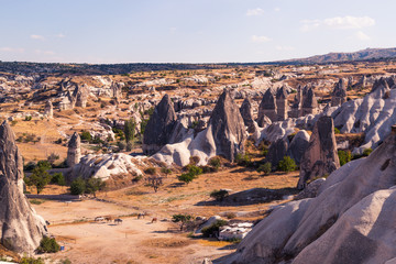 Erosion of many rocks in the desert. Dry and hot. Touristic place Cappadocia, land of love. Landscape of rocks and hills