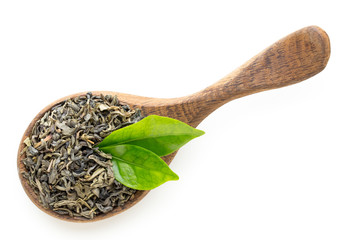 Green tea leaf the spoon isolated on white background.