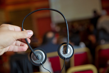A set of headphones for simultaneous translation during negotiations in foreign languages ....