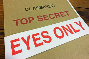 An EYES ONLY sealing strip around a top secret file.