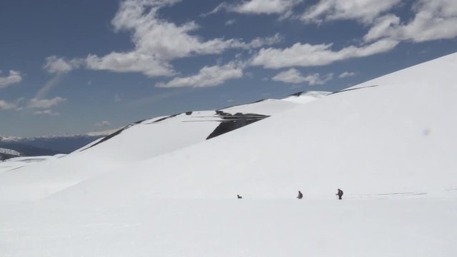 People walking in a mountain with snow in Chile
