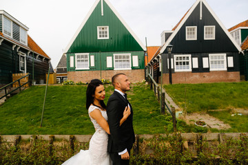 beautiful wedding couple posing in village