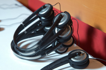 A set of headphones for simultaneous translation during negotiations in foreign languages ....