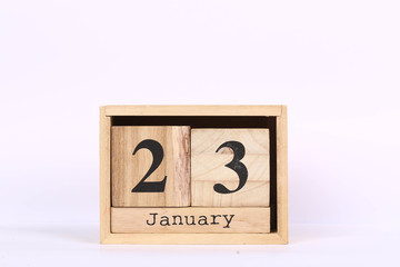 Wooden cubes calendar with the date of January 23. Concept calendar for year with copy space isolated on white background