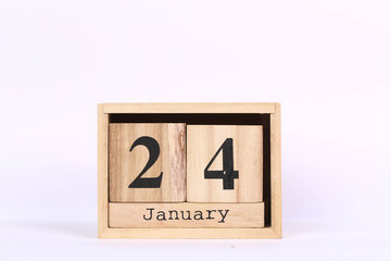 Wooden cubes calendar with the date of January 24. Concept calendar for year with copy space isolated on white background