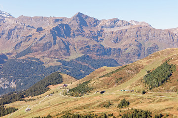 Train descending from Kleine Scheidegg towards Wengernalp station; view from Fallbodensee...