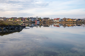 Fototapeta na wymiar Part of the Bronnoysund development is reflected in the sea,Nordland county