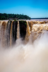 Water crashes over the top of Iguazu Falls causing vast clouds of mist in Parque Nacional Iguazú in north eastern Argentina