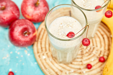 Smoothie with oat or oatmeal, banana and  red apples