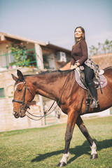 female rider sitting on her horse