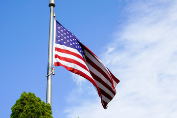 USA flag on the blue sky