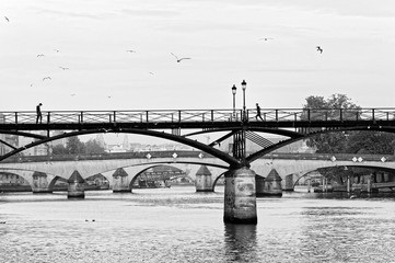 walking and running on pont des Arts bridge in Paris