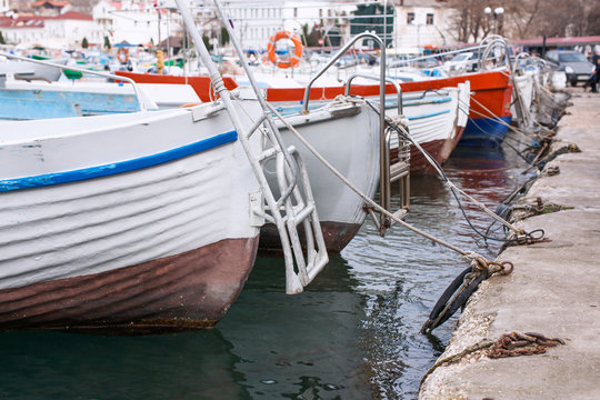 Boats moored at the concrete pier in Balaklava