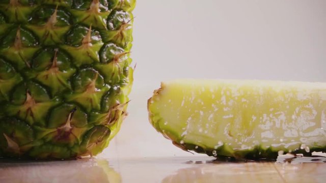 Pineapple slice separate . Slow motion