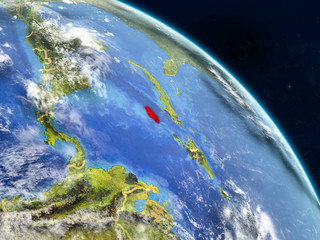 Jamaica from space on realistic model of planet Earth with country borders and detailed planet surface and clouds.