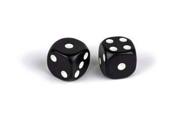 Two black dice isolated on a white background. One and four.