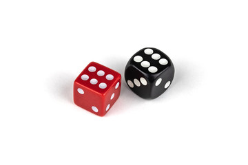 Two dice isolated on white background. Red six and black six.