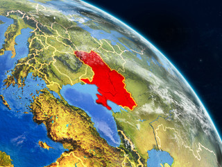 Ukraine from space on realistic model of planet Earth with country borders and detailed planet surface and clouds.