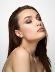 Natural beauty portrait of pretty girl on a bright background