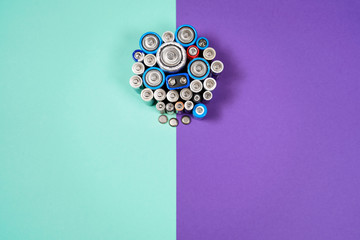 Many different types used or new battery, rechargeable accumulator, alkaline batteries on color...