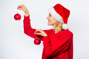 Woman wear santa hat hold two balls decor ornament for christmas. How decorate for winter. Easy...