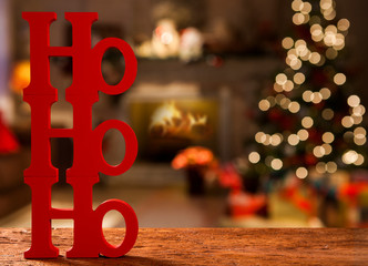 Merry Christmas ho ho ho greeting message with christmas blurry light background.
