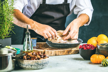 Chef preparing stuffed duck